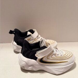 Nike Black, White, and Gold Athletic Shoes